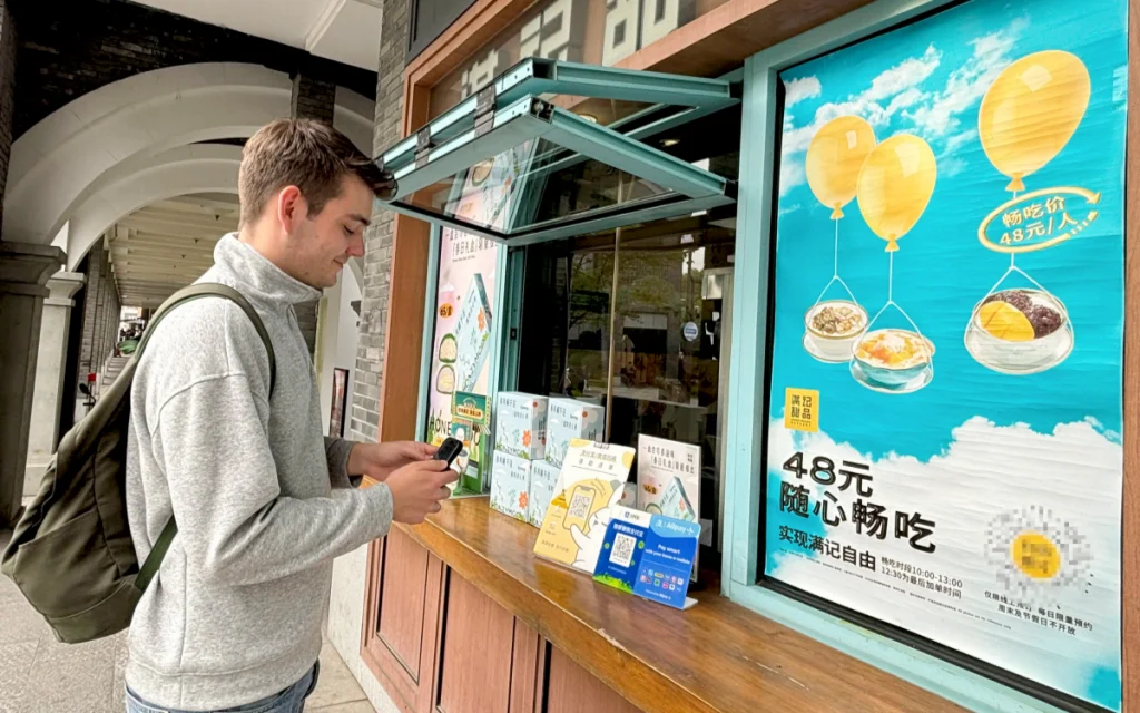 A man is paying with Alipay