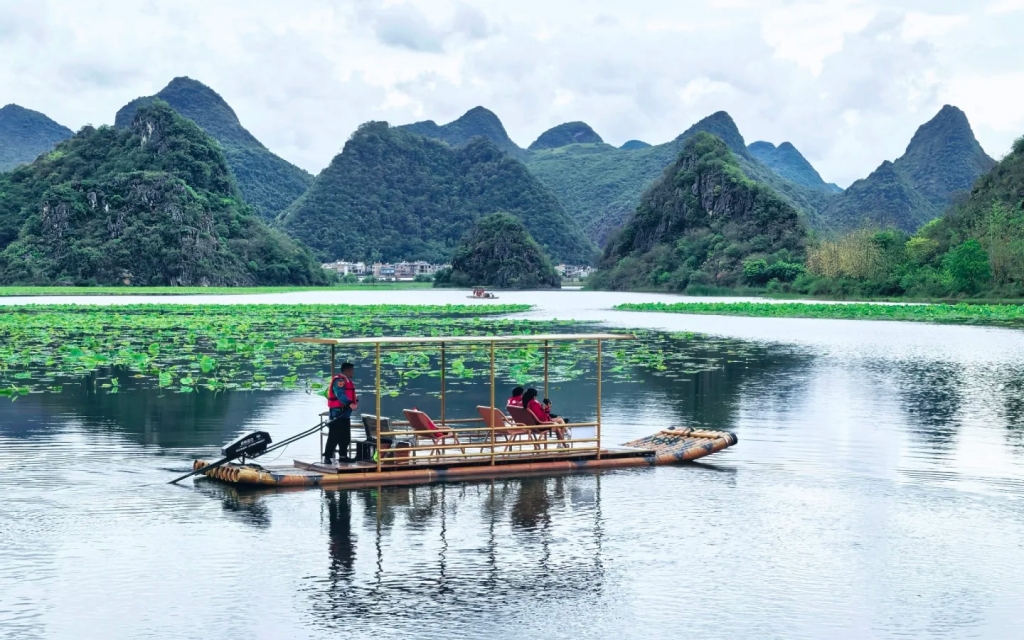 Boating through the Xihuang Wetlands of Puzhehei