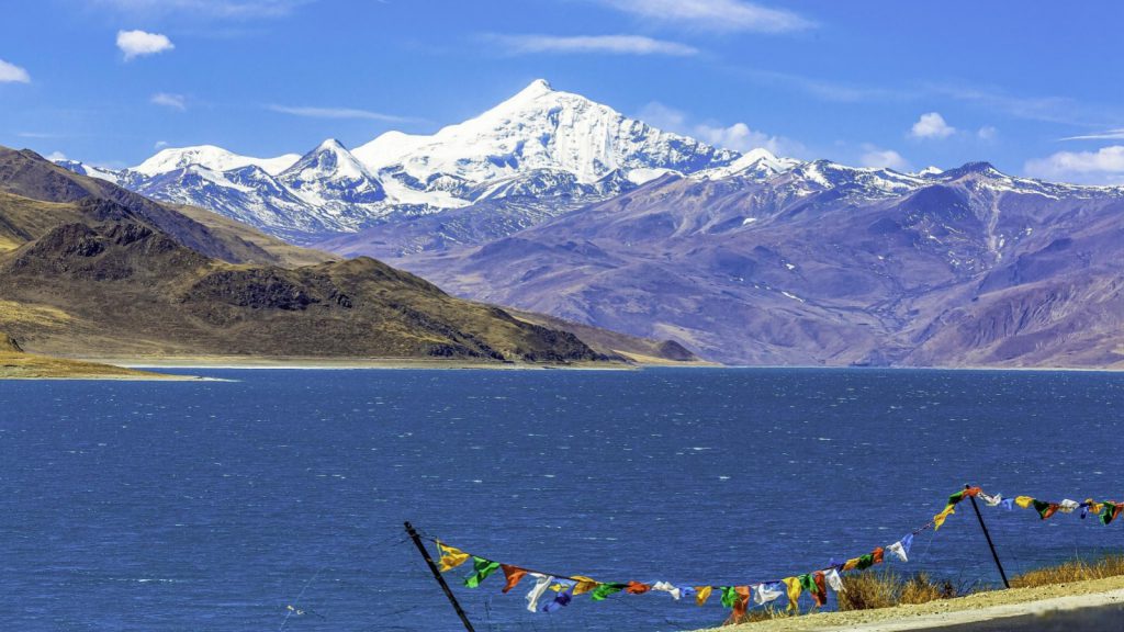 The sacred waters of Namtso, mirroring the endless blue sky and towering mountains.