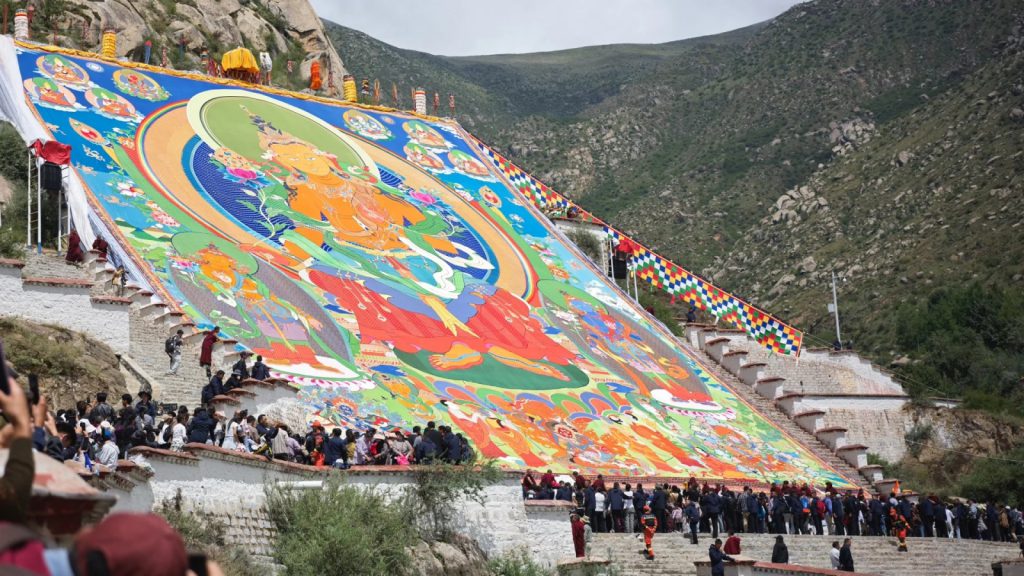 The iconic thangka unveiling ceremony at Drepung Monastery during the Shoton Festival.