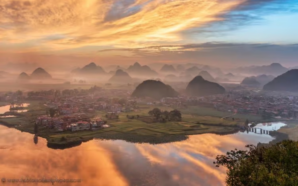 The sunset glow over Qinglong Mountain in Puzhehei