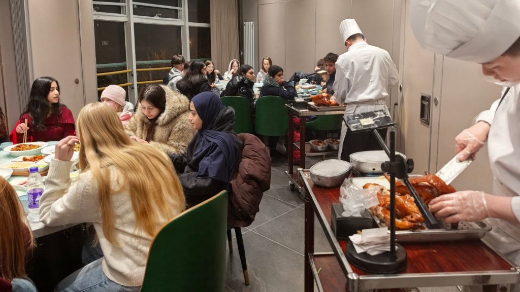 The students enjoying a classic Peking duck dinner in Beijing.