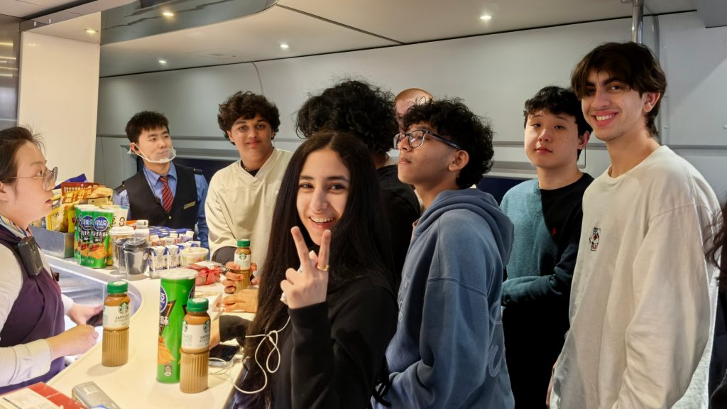 Students are enjoying their high-speed train journey to Beijing
