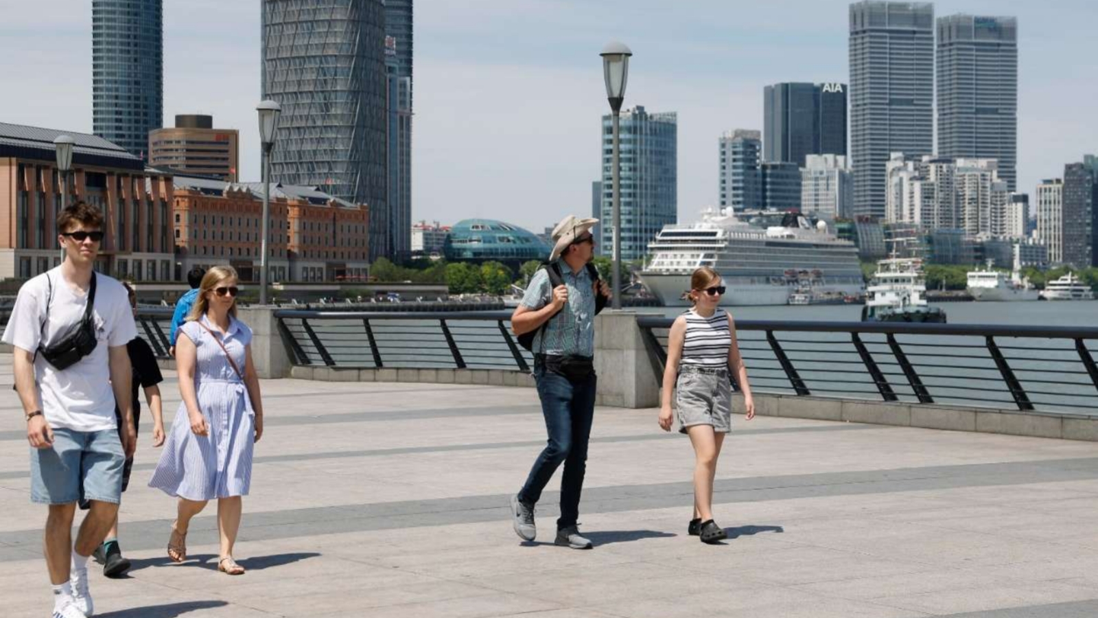 Travelers are visiting the Bund in Shanghai.