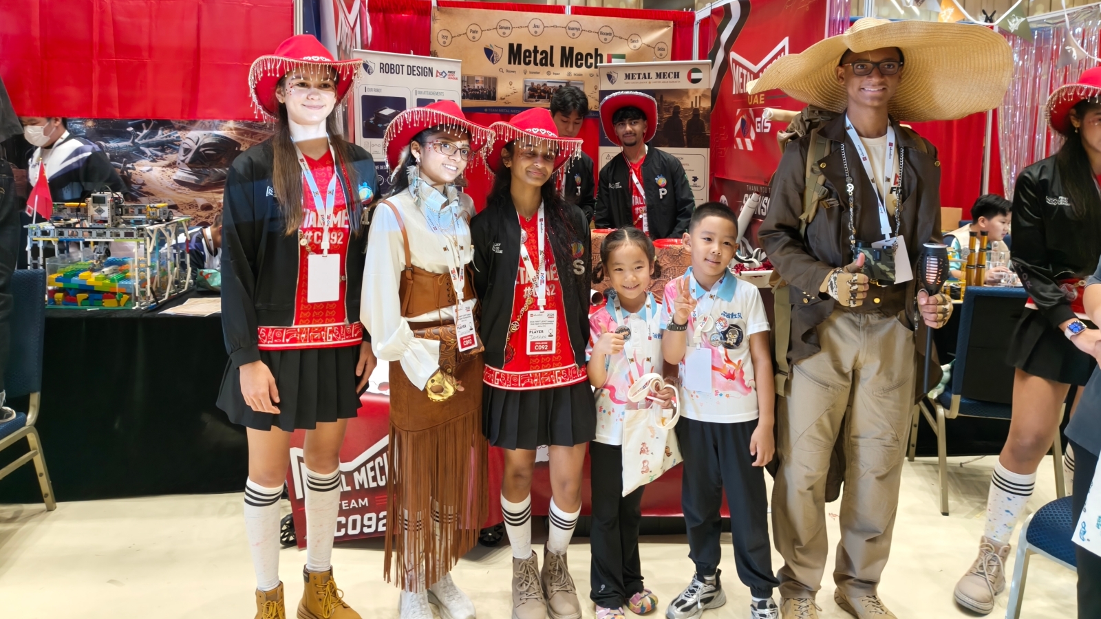UAE robotics students meet local children at the FLL team display area in Beijing